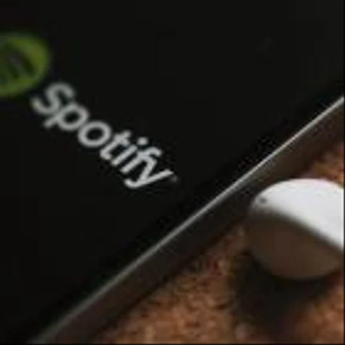 Spotify, and Duluth Holdings have been highlighted as Zacks Bull and Bear of the Day