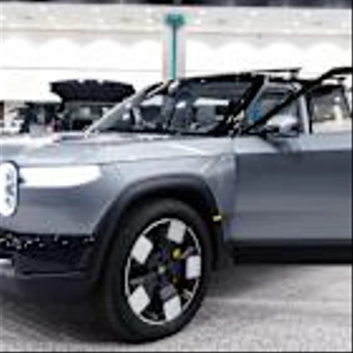 Rivian deliveries decline, Wayfair & RH jump on tariff delay