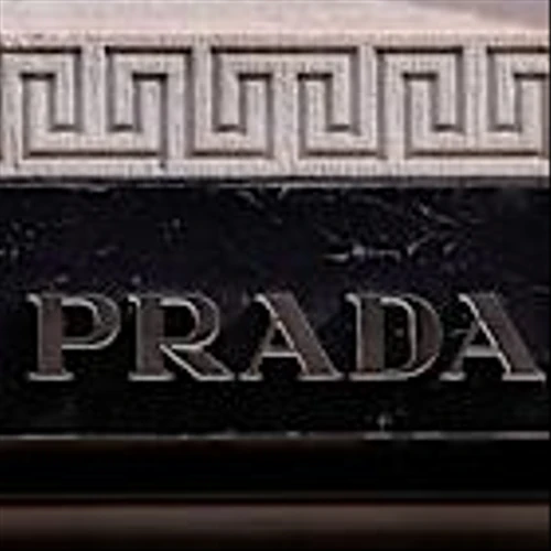 Prada's CEO flies to New York as speculation swirls over Versace bid