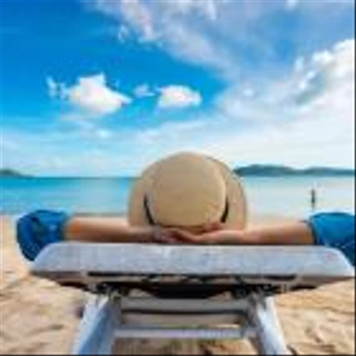 50-Year-Old Earning $12,100 a Month in Dividends Shares His Top 13 Stocks – 'I'm Sitting on a Beach in Thailand Feeling Like I'm Still 30'