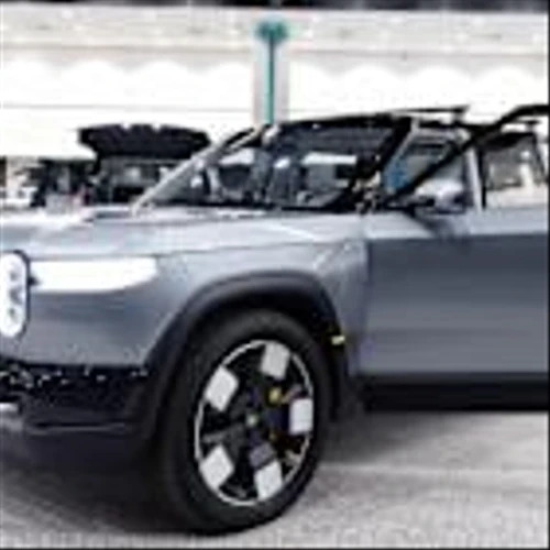 Rivian deliveries decline, Wayfair & RH jump on tariff delay