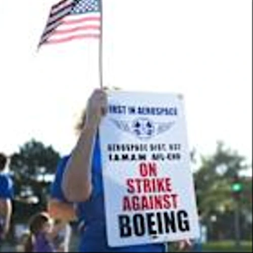 Striking Boeing workers reject latest offer as earnings loom