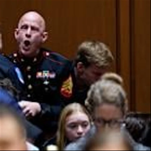Senator joins police to remove Marine veteran protesting war from hearing
